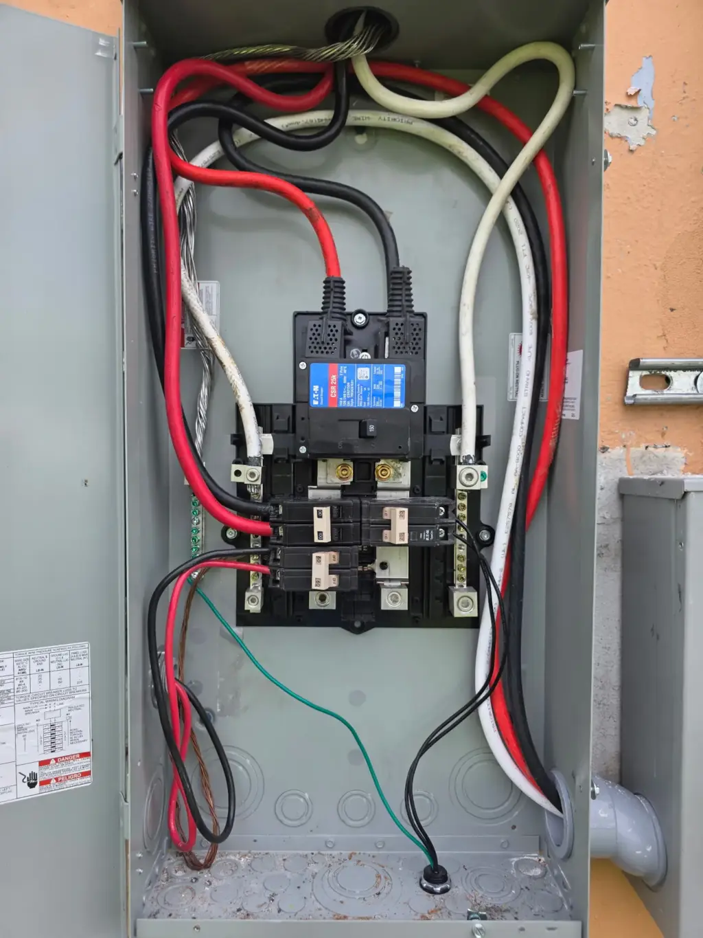 Newly wired outdoor breaker panel with the cover removed